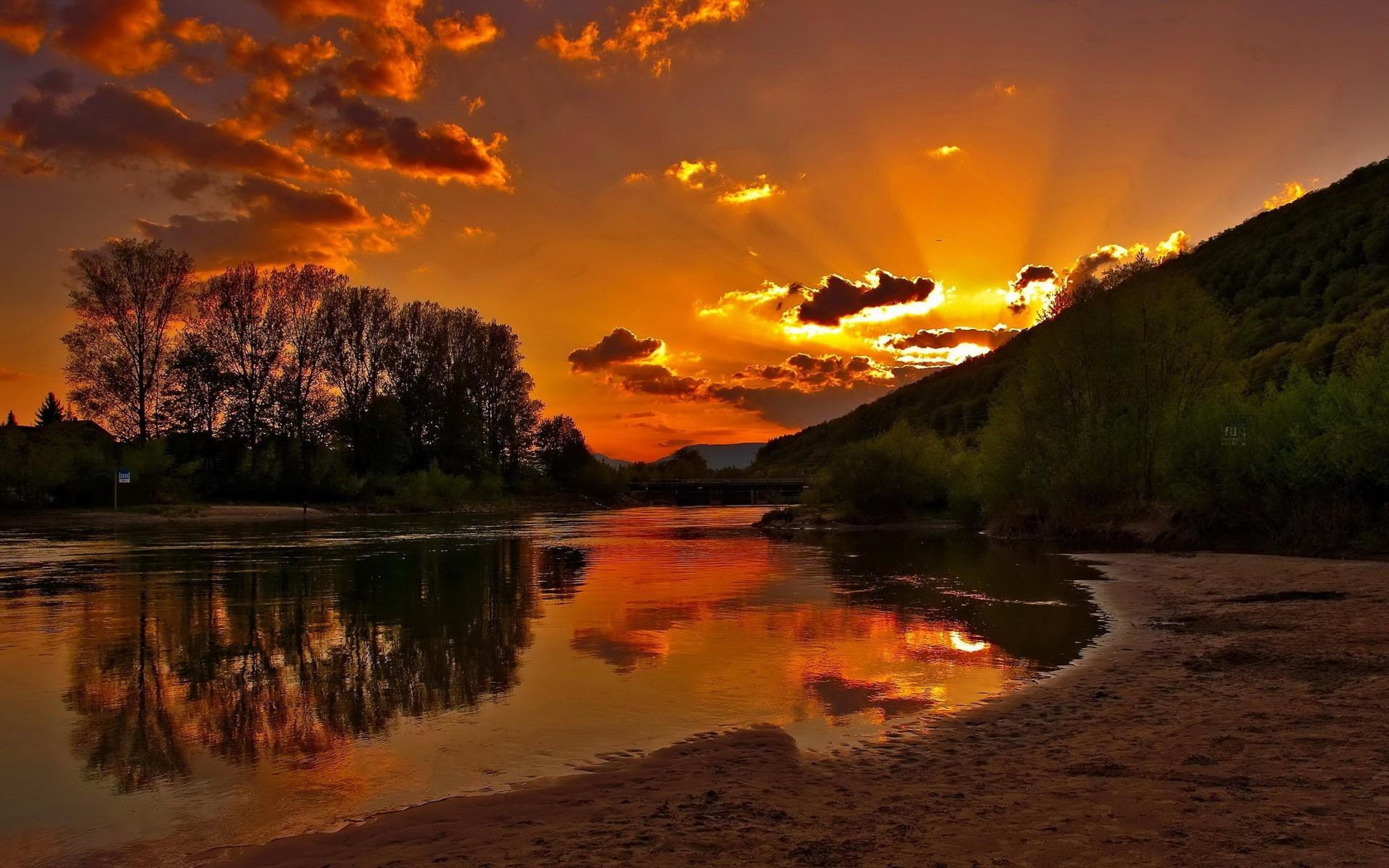 Sunset Sandy River Plazha.crveno Sky With Dark Cloud Reflection In