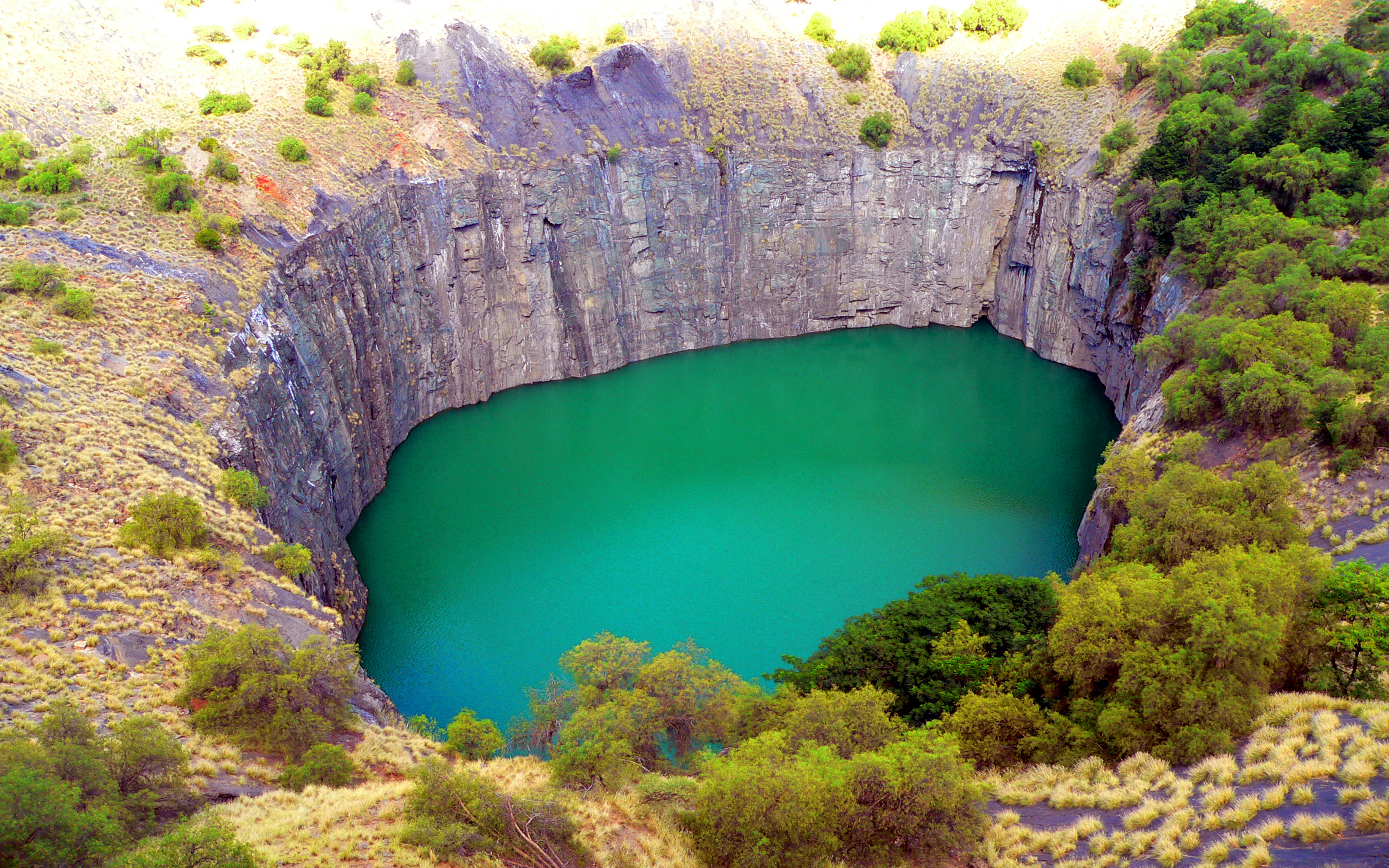 Big Hole With Turquoise Green Water Kimberley,south Africa Desktop