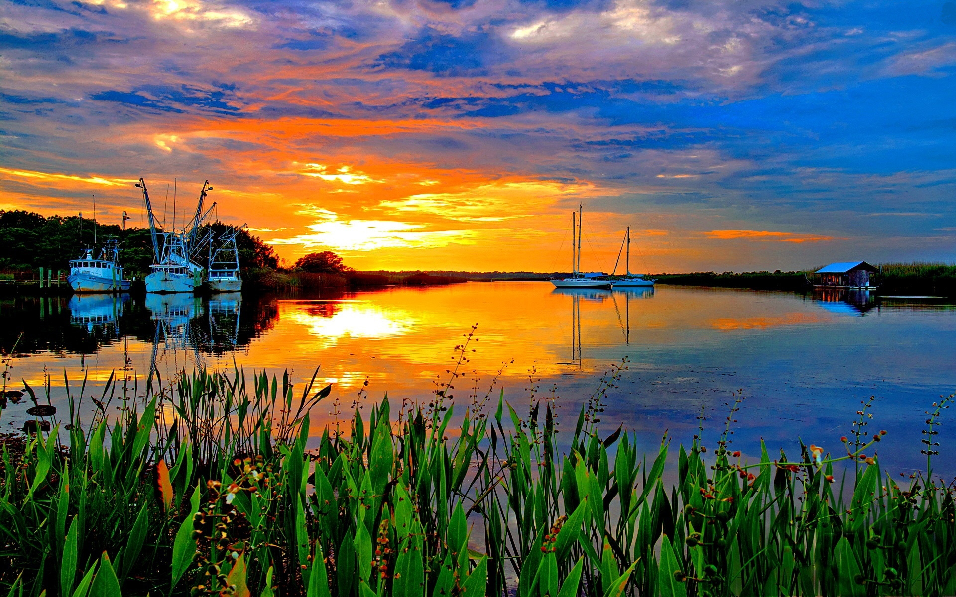 Sunset Over The Horizon Lake Grass Anchored Ships A Wooden ...
