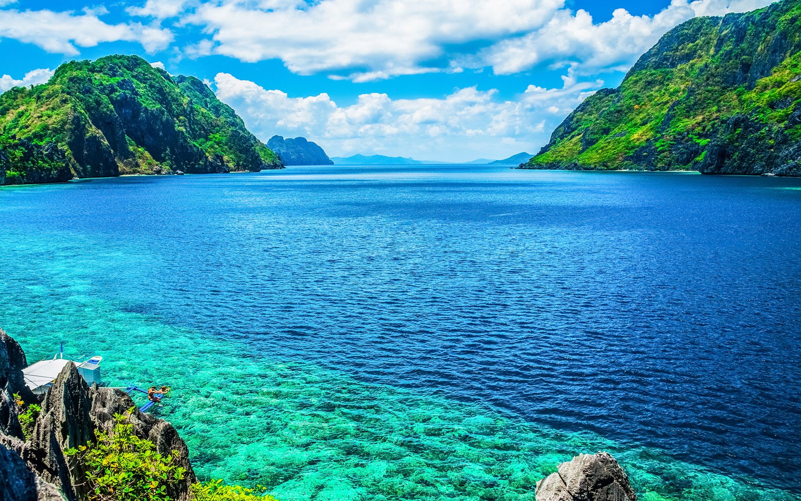 Palawan Philippines A Scenic View Of The Sea And Mountain  